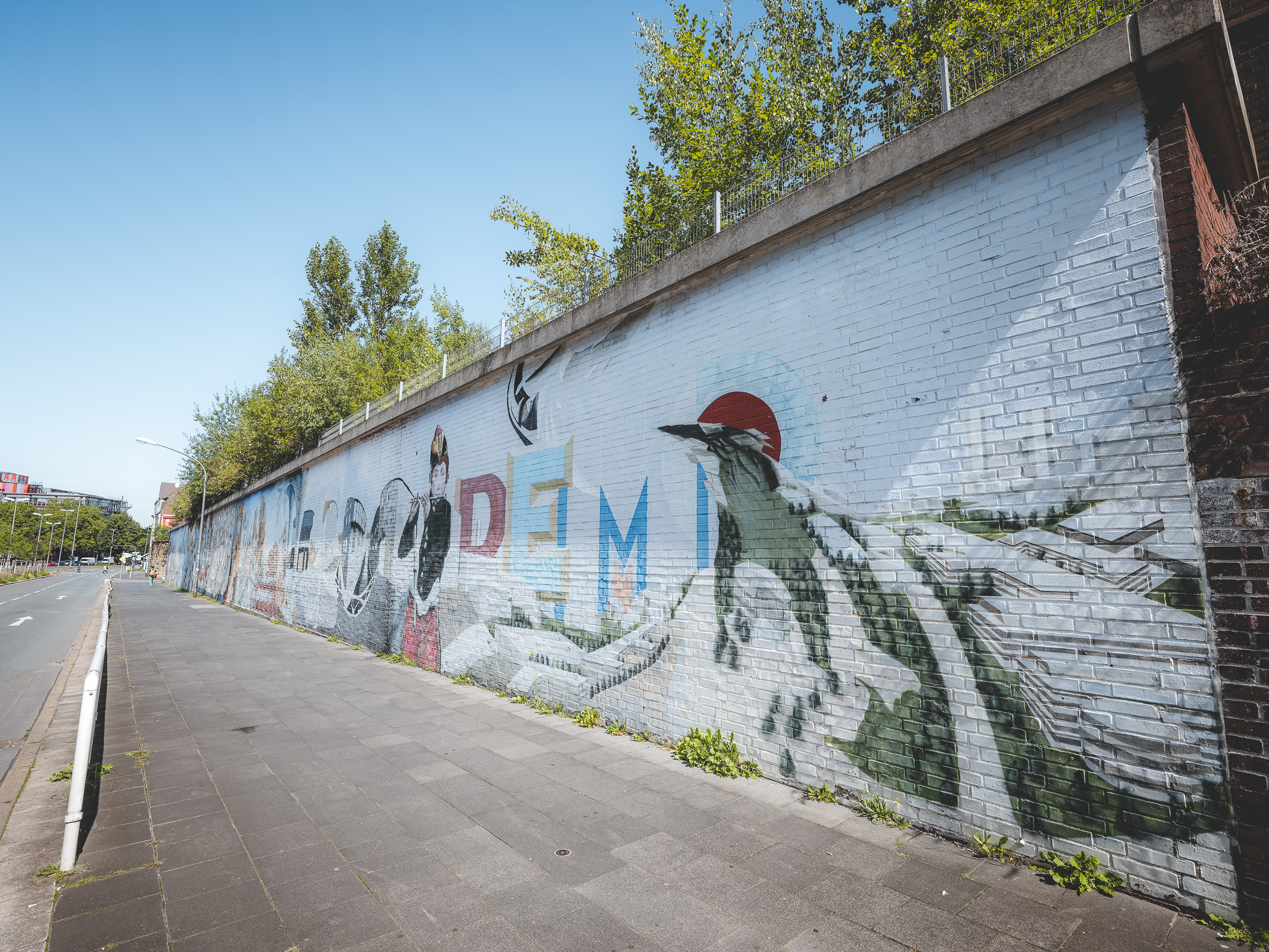 Das Foto zeigt ein Mural bei einem Graffitti Walk durch Essen